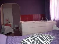 A bed or beds in a room at Gelov Hotel