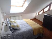 Posteľ alebo postele v izbe v ubytovaní Ático Cine Colón