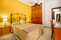 Posteľ alebo postele v izbe v ubytovaní HOTEL-FINCA Rural José Manuel 28pax
