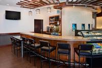 a bar with chairs around it in a room at Hyatt Place Pittsburgh North Shore in Pittsburgh
