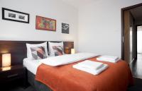 Łóżko lub łóżka w pokoju w obiekcie Apartamenty Starówka - Melody