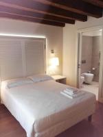 Postel nebo postele na pokoji v ubytování Agriturismo Villa Trovatore