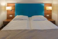 Posteľ alebo postele v izbe v ubytovaní Holiday Home Aparthotel z balkonem przy plaży