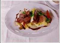 um prato branco de comida numa mesa em Müller´s Landhotel em Mespelbrunn