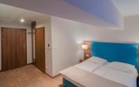 Posteľ alebo postele v izbe v ubytovaní Holiday Home Aparthotel z balkonem przy plaży