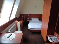 Łóżko lub łóżka w pokoju w obiekcie Hotel Wielkopolanka
