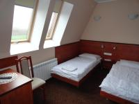 Łóżko lub łóżka w pokoju w obiekcie Hotel Wielkopolanka
