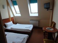 Łóżko lub łóżka w pokoju w obiekcie Hotel Wielkopolanka
