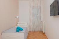 Postel nebo postele na pokoji v ubytování Apartments Radeljić