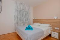 Postel nebo postele na pokoji v ubytování Apartments Radeljić