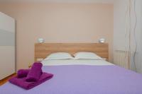 Postel nebo postele na pokoji v ubytování Apartments Radeljić