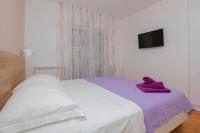 Postel nebo postele na pokoji v ubytování Apartments Radeljić