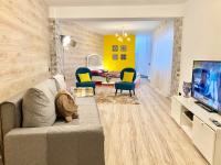 Televízia a/alebo spoločenská miestnosť v ubytovaní Apartament Mercado Central