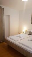 Posteľ alebo postele v izbe v ubytovaní Apartments Corner