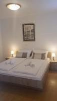 Posteľ alebo postele v izbe v ubytovaní Apartments Corner