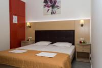 Postel nebo postele na pokoji v ubytování Rose Club Apartments