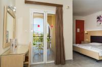 Postel nebo postele na pokoji v ubytování Rose Club Apartments
