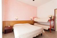 Posteľ alebo postele v izbe v ubytovaní Hotel Arborea