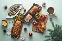 a table topped with cutting boards with different types of food at PARKROYAL COLLECTION Marina Bay, Singapore in Singapore