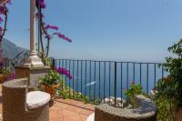a balcony with chairs and a view of the ocean at Villa Ambra Positano in Positano