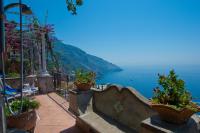 a view of the ocean from a balcony with potted plants at Villa Ambra Positano in Positano