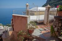 a house with a balcony with a view of the ocean at Villa Ambra Positano in Positano