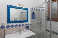 a bathroom with a sink and a mirror and a shower at Villa Ambra Positano in Positano