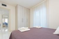 Postel nebo postele na pokoji v ubytování Apart-rent Apartamento Francesc Macia 2003