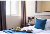 Postel nebo postele na pokoji v ubytování JOIVY Downtown Market Apartments