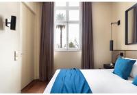 Postel nebo postele na pokoji v ubytování JOIVY Downtown Market Apartments