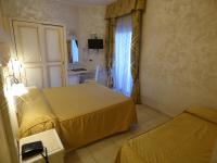 Posteľ alebo postele v izbe v ubytovaní Hotel Diplomat Palace