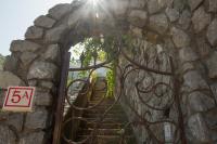 an entrance to a gate with a stone wall and stairs at Villa Ambra Positano in Positano