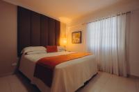 Postel nebo postele na pokoji v ubytování Hotel La Colonia