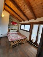A bed or beds in a room at IL SANTO GRAAL