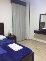 Postel nebo postele na pokoji v ubytování Lady Queen Apartment