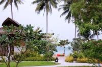 a resort with palm trees and a fire hydrant at Maehaad Bay Resort - SHA Plus in Mae Haad