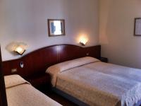 Posteľ alebo postele v izbe v ubytovaní Hotel Arborea
