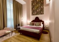Postel nebo postele na pokoji v ubytování INTOMILAN Galleria Duomo I Boutique & Design Aparthotel