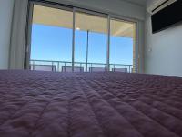 A bed or beds in a room at Ático en primerísima linea de playa!!!