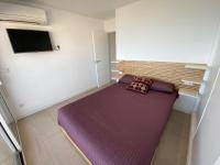 A bed or beds in a room at Ático en primerísima linea de playa!!!