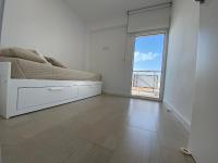A bed or beds in a room at Ático en primerísima linea de playa!!!