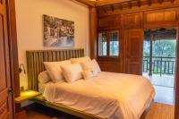Tira Vilagna Suites & Spaにあるベッド