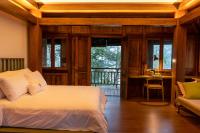 Tira Vilagna Suites & Spaにあるベッド