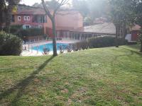 a yard with a swimming pool and a house at Hotel Albatros in Mouans-Sartoux