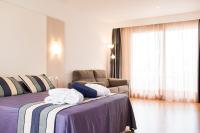 A bed or beds in a room at Sagitario Playa