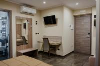 A television and/or entertainment centre at Miryam House Affittacamere Suite e Relax