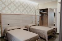 A bed or beds in a room at Miryam House Affittacamere Suite e Relax