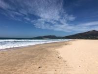 a sandy beach with a view of the ocean at Hotel Punta Sur in Tarifa