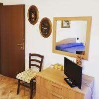 Televízia a/alebo spoločenská miestnosť v ubytovaní La casa di Gina
