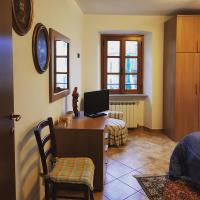 Televízia a/alebo spoločenská miestnosť v ubytovaní La casa di Gina